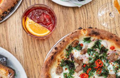  A photo of pizza and drinks at Pizza East