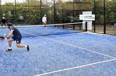 4 people play Padel on a Padel court