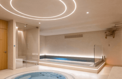 Inside a spa, showing a plunge pool and sauna