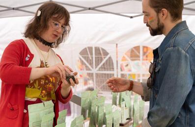 Two people at a market stall