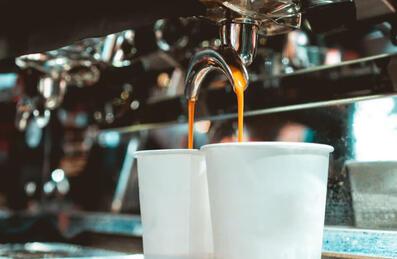 coffee pouring into paper cups