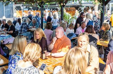 A crowd of people at the terrace area of Snoozebox