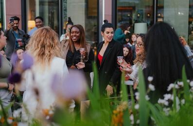 People dancing on a terrace outside Kitchen E20 restaurant