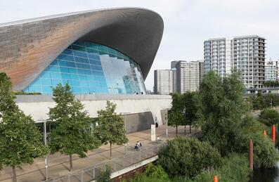 London Aquatics Centre with high-rise flats in the background