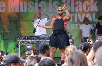 MNEK performs on stage