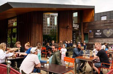 People enjoying the outdoor terrace at Timber Lodge