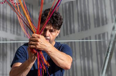 Artist Conrad Shawcross ties cord together