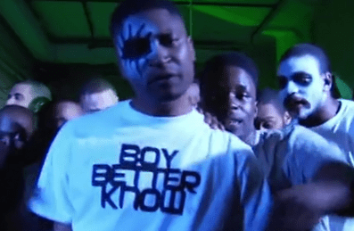 A group of men in face paint in a music video