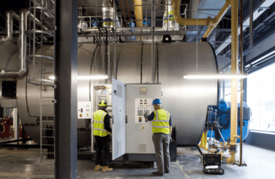 Photos of two workers in the Energy Centre on Queen Elizabeth Olympic Park