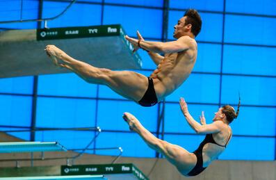 Two people diving