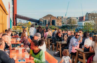 People eating and drinking at Hackney Bridge
