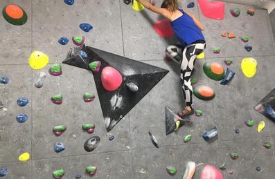 woman rock climbing