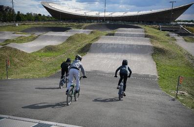 three people cycling at the BMX park