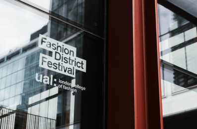 A door showing the Fashion District and UAL: London College of Fashion logos