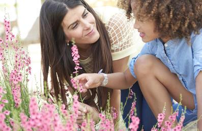 Mother and child looking at flowers