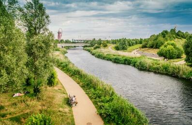 people sitting by a river