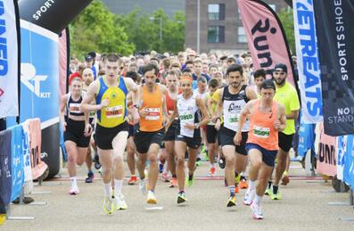 a group of runners set off from the start line