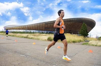 a runner runs past the lee valley velopark