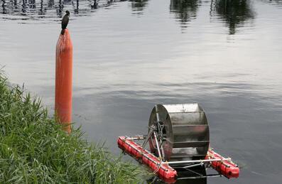 Water wheel floating on a river