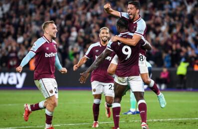 West ham players celebrate scoring a goal