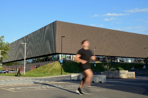 A man running past the Copper Box Arena